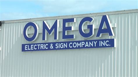 omega electric and sign alpena.